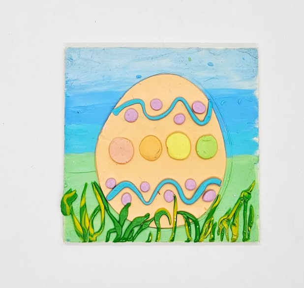spring craft for kids shows a spring Easter egg made on a square block.