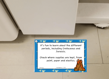 kindergarten activity shows a game riddle below a photocopier.