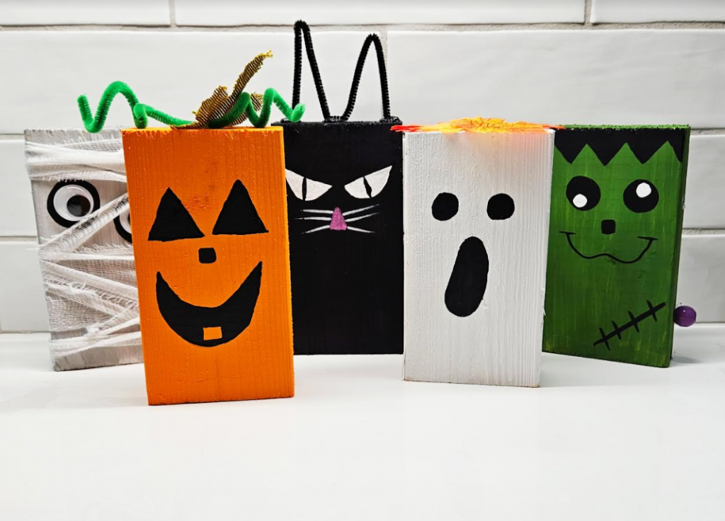 easy Halloween craft for kids shows five wooden block characters.