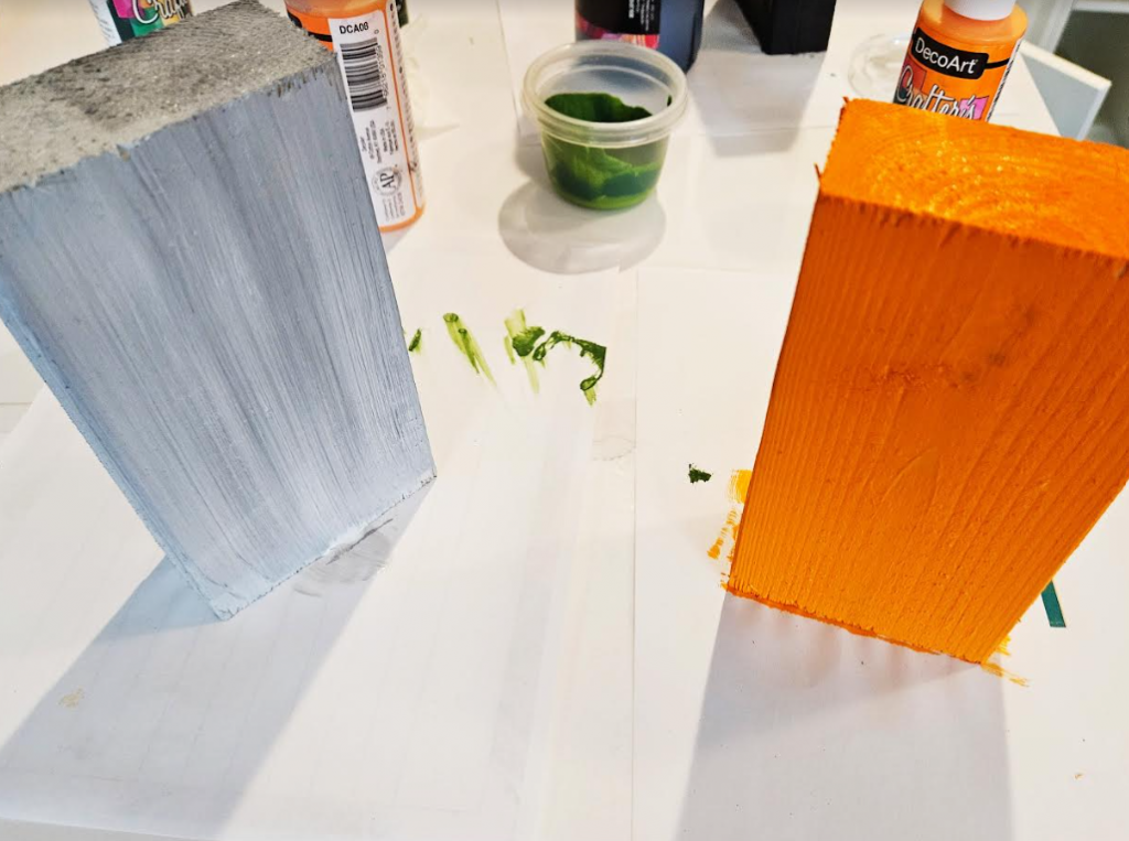 easy Halloween craft for kids shows a grey and orange block.