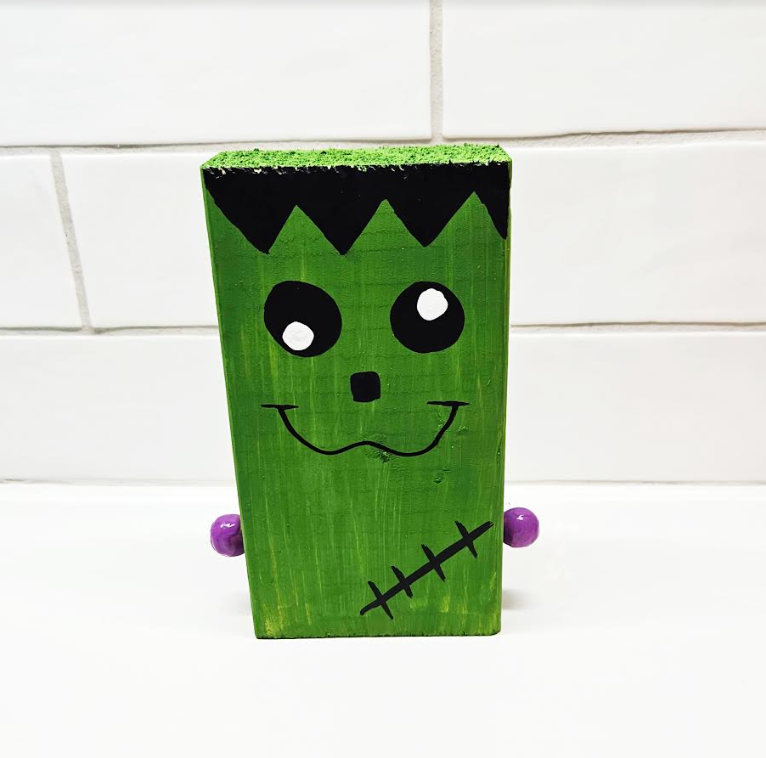 art project for kids shows a Frankenstein wooden block craft.