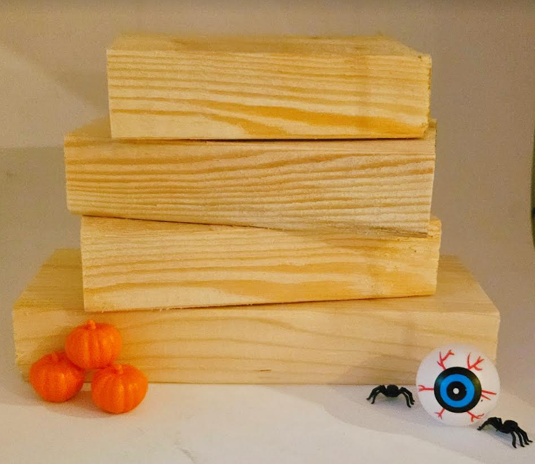easy Halloween craft for kids shows a stack of 4 wooden blocks.