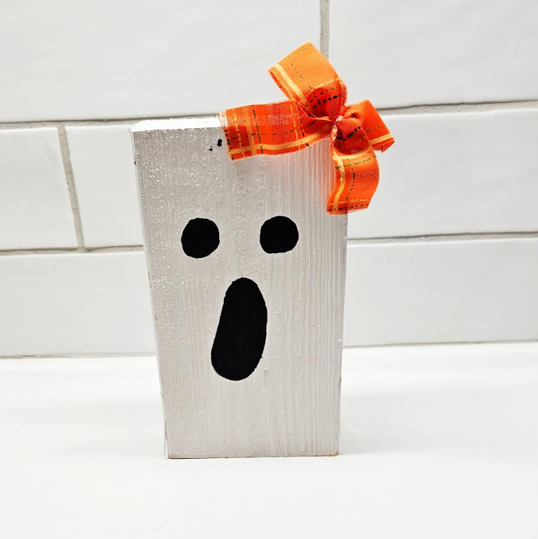 easy halloween craft for kids shows a ghost block craft.
