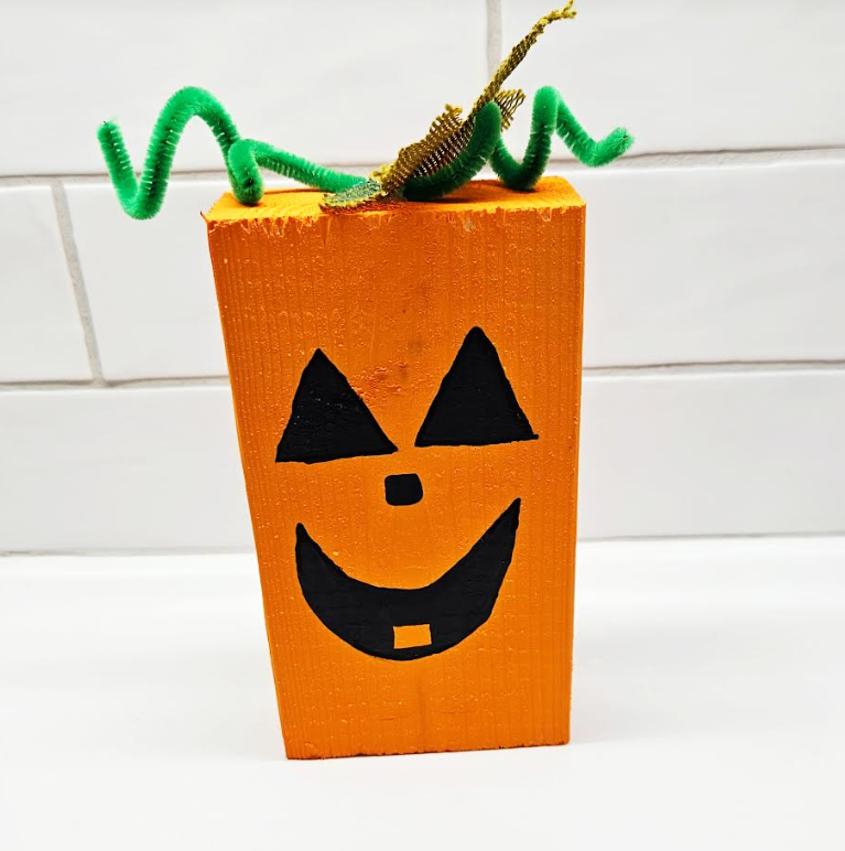 easy halloween craft for kids shows a pumpkin craft.