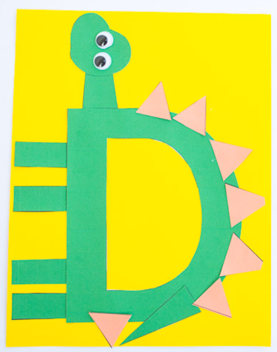 arts and crafts for kids shows the letter D and cut outs added to look like a dinosaur.