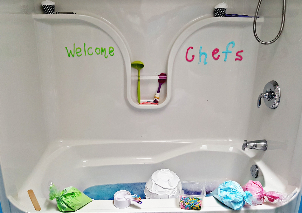 sensory activity for kids shows a bath tub that says welcome chefs and shaving cream bags and beads and measuring spoons.