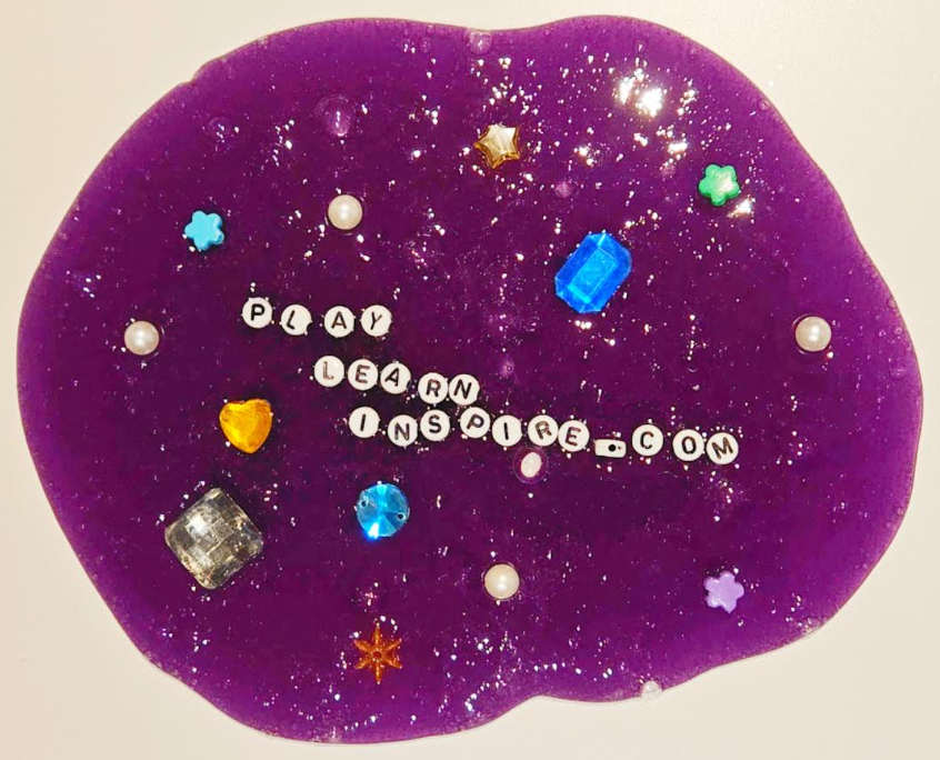 slime project for kids shows a oozing ball of purple slime with alphabet beads that says "Play Learn Inspire".