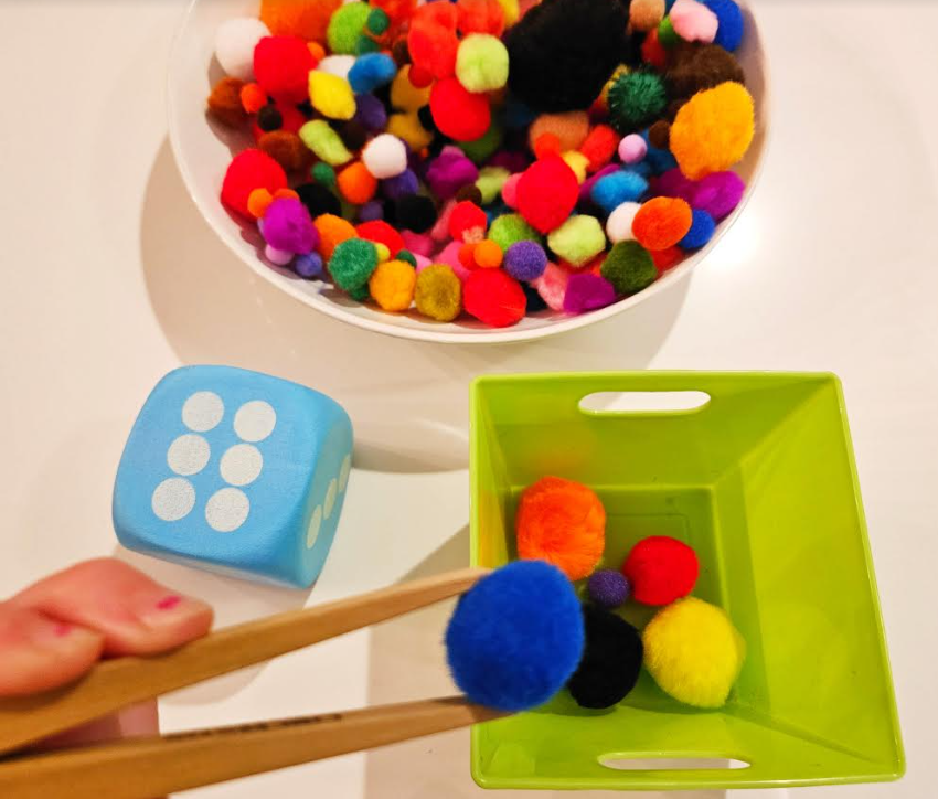 Easy Kindergarten Math Activity shows a child putting pompoms in a container using chopsticks.