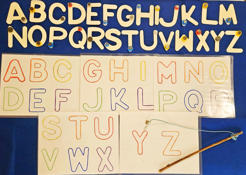 letter games for kindergarten shows the alphabet in wooden letters and alphabet sheets.