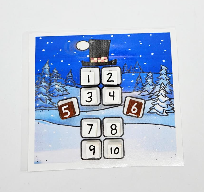 math activity shows a snowman with 10 blocks on it to make the features of the man.