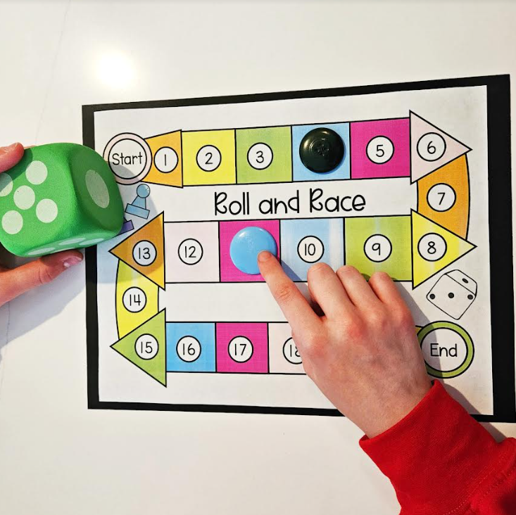 free printable math game shows two children playing a math game.