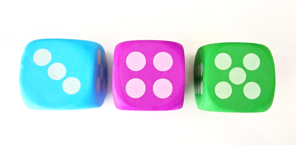 counting game show three dice. one blue, one purple and one green.