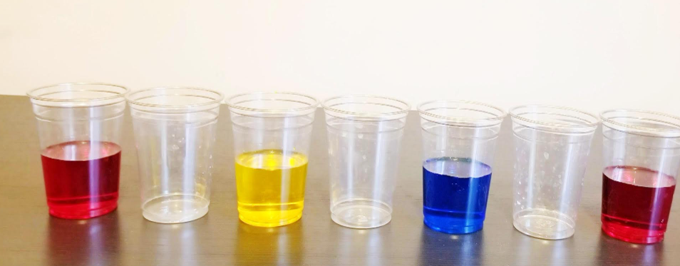 science shows seven cups and four with colored water.