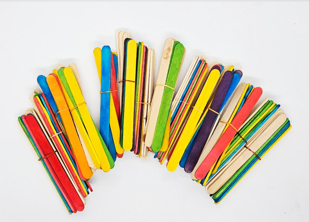 Making Shapes Activity for Kindergarten shows piles of popsicle sticks.