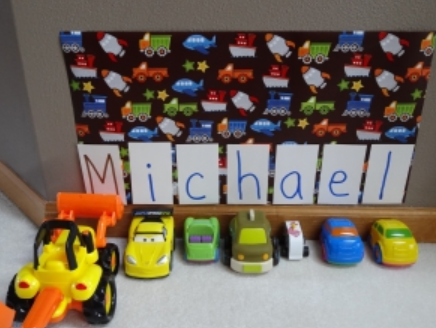 best letter activities for kindergarten shows a line of cars and the name Michael.
