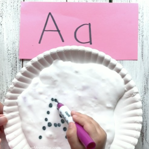 best letter activities for kindergarten shows the letter A being printed in slime with a marker.