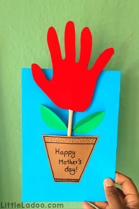 Mother's Day Gifts for Kindergarteners to Make shows a handprint card where the handprint is a flower.
