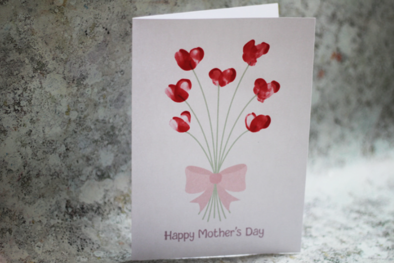 Mother's Day Gifts for Kindergarteners to Make shows a card with flowers made from fingerprints.