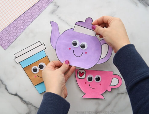 art for kids shows a child holding a tea pot craft.
