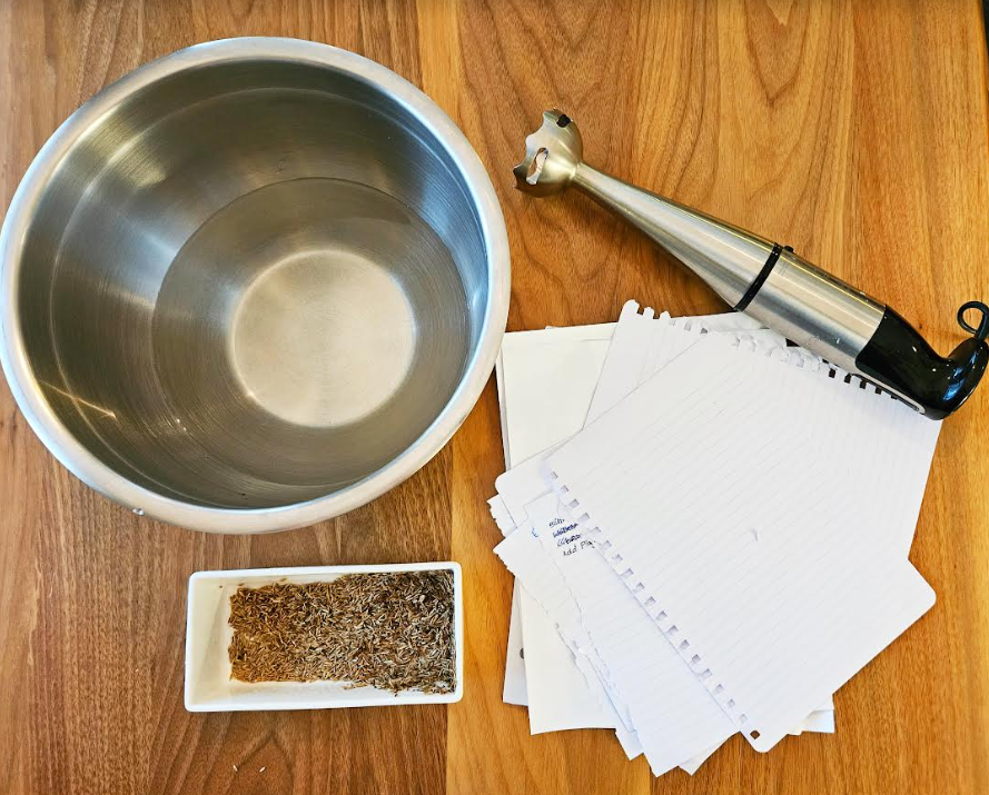 diy Fathers Day gift idea shows a blender, paper, seeds and a bowl of water.