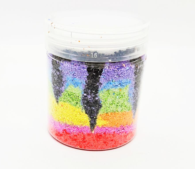 easy summer craft for kids shows a finished jar with rainbow layers of chalk salt and lines of black chalk salt running through the sides.