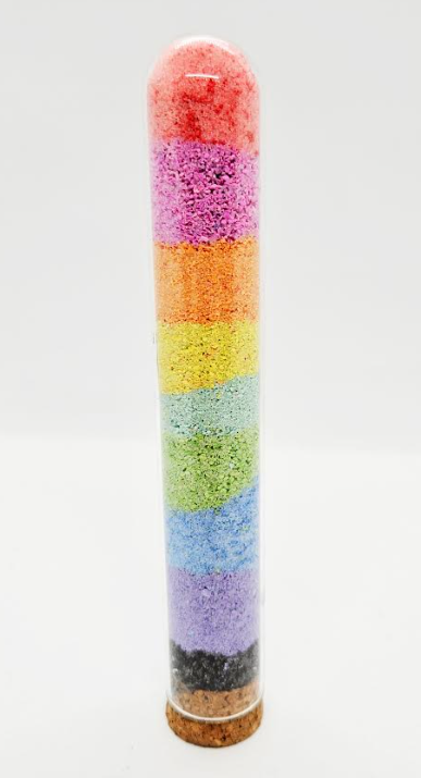 rainbow in a jar shows chalk dust layered in a tube.