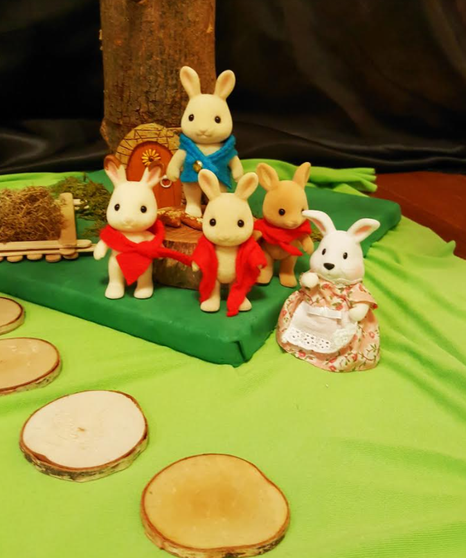 storytelling for kids shows the characters from Peter Rabbit and a few set pieces to use to retell.