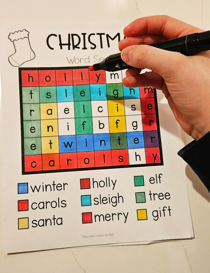 free christmas word search for young kids shows a child completing a word search that's Christmas themed.