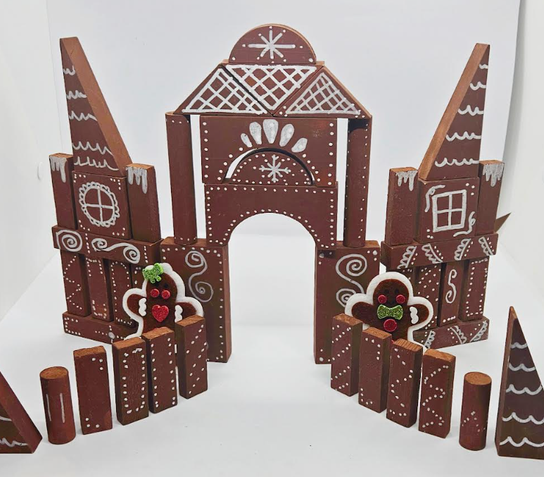 diy gingerbread house with blocks shows a gingerbread house that's been built with wooden blocks.