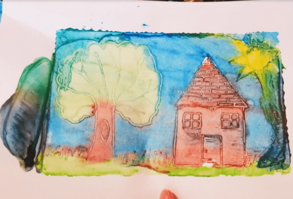 easy printmaking craft for kids shows a house image made from DIY printmaking project.