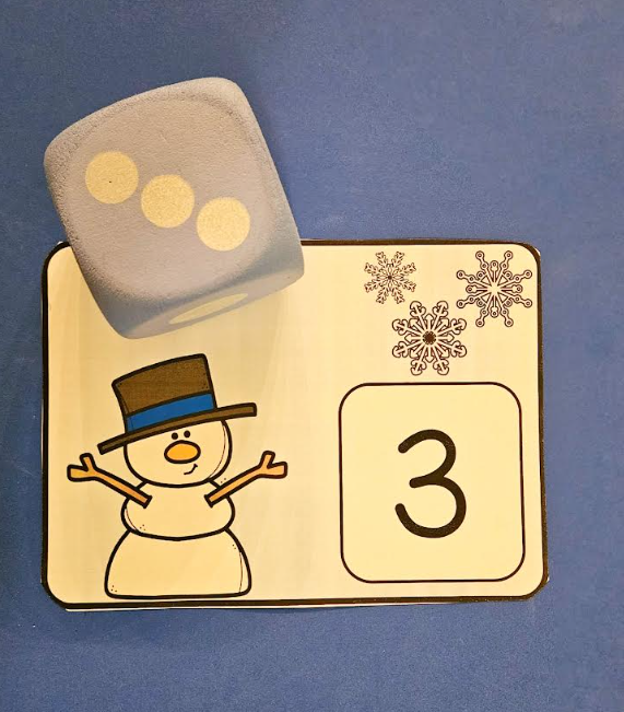 math worksheets for preschool shows a winter card with the number three and three snowflakes.