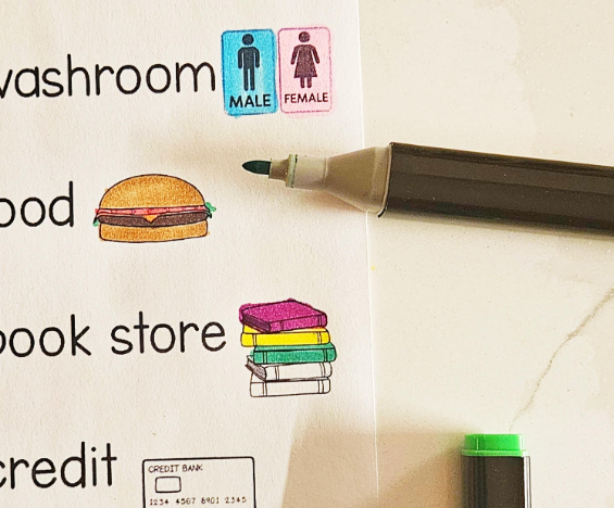 mall activity for kids shows someone coloring pictures on a printable hunt page.